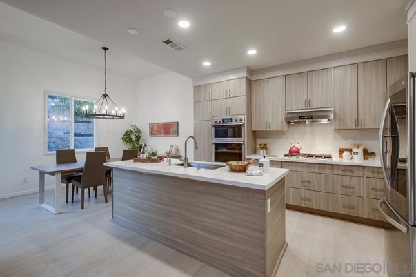 Chandelier, Dining room, Interior, Kitchen, Pendant Lights, Recessed Lighting, Stainless Steel Appliances, Wood Texture Flooring