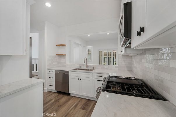 Interior, Kitchen, Recessed Lighting, Stainless Steel Appliances, Wood Texture Flooring
