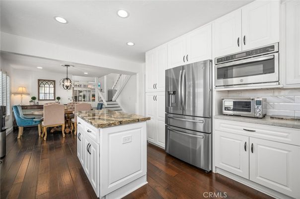 Chandelier, Dining room, Interior, Kitchen, Pendant Lights, Recessed Lighting, Stainless Steel Appliances, Wood Texture Flooring