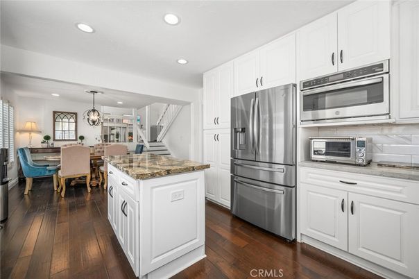 Chandelier, Dining room, Interior, Kitchen, Pendant Lights, Recessed Lighting, Stainless Steel Appliances, Wood Texture Flooring