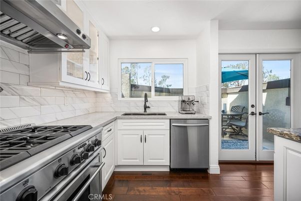 Interior, Kitchen, Recessed Lighting, Stainless Steel Appliances, Washer, Wood Texture Flooring