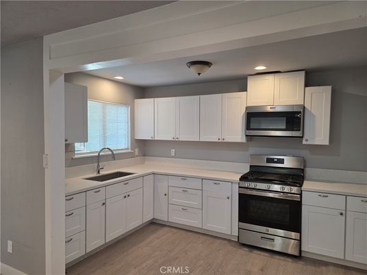 Interior, Kitchen, Recessed Lighting, Stainless Steel Appliances, Wood Texture Flooring