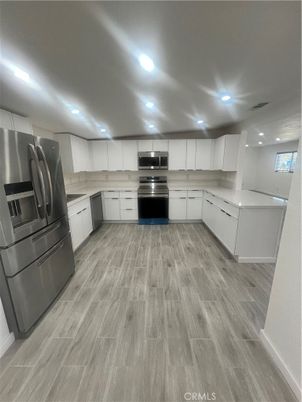 Interior, Kitchen, Recessed Lighting, Stainless Steel Appliances, Wood Texture Flooring