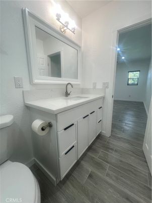 Bathroom, Dual Sink Vanities, Interior, Recessed Lighting, Wood Texture Flooring