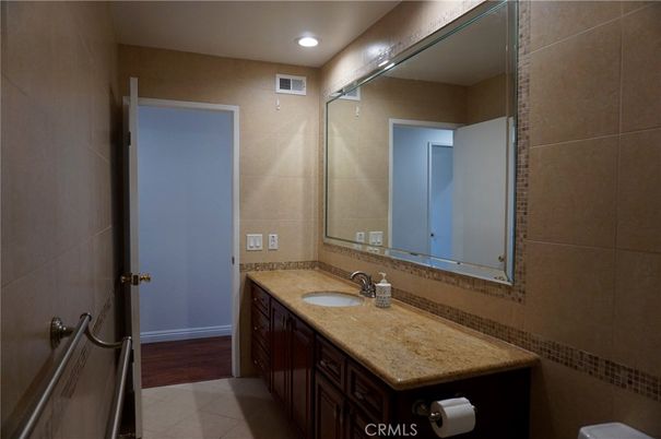 Bathroom, Dual Sink Vanities, Interior, Recessed Lighting, Wood Texture Flooring