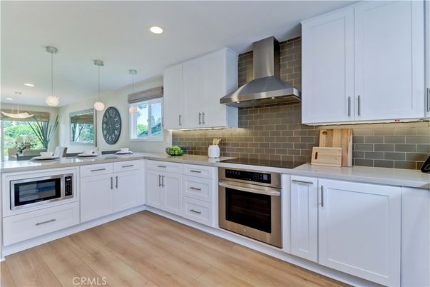 Interior, Kitchen, Pendant Lights, Recessed Lighting, Stainless Steel Appliances, Wood Texture Flooring