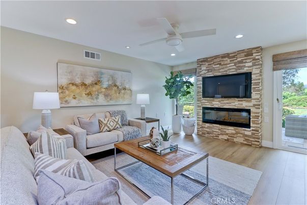 Fireplace, Interior, Living room, Recessed Lighting, Stone Walls, Wood Texture Flooring