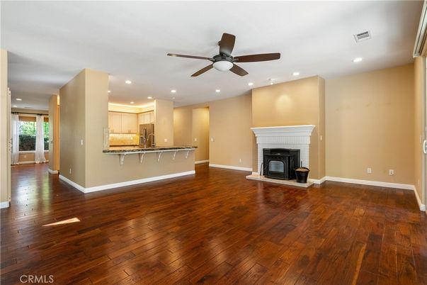 Empty room, Fireplace, Interior, Kitchen, Recessed Lighting, Wood Texture Flooring