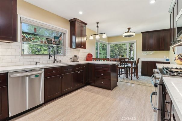 Dining room, Interior, Kitchen, Pendant Lights, Recessed Lighting, Stainless Steel Appliances, Wood Texture Flooring