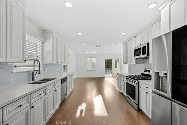 Interior, Kitchen, Recessed Lighting, Stainless Steel Appliances, Wood Texture Flooring