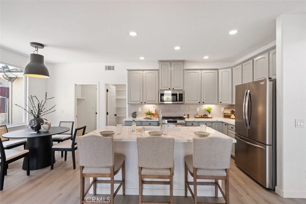 Dining room, Interior, Kitchen, Recessed Lighting, Stainless Steel Appliances, Wood Texture Flooring