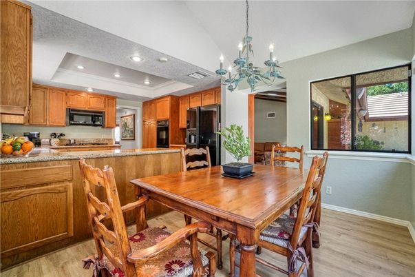 Chandelier, Dining room, Interior, Kitchen, Recessed Lighting, Stainless Steel Appliances, Wood Texture Flooring