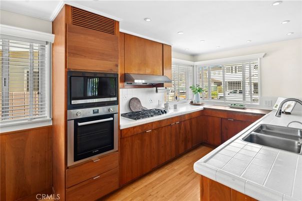 Interior, Kitchen, Recessed Lighting, Tile Countertops, Wood Texture Flooring