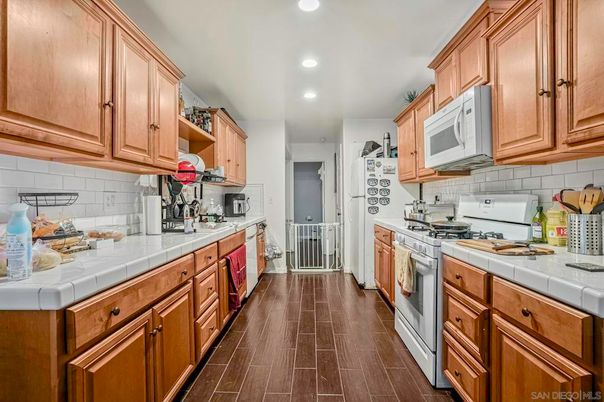 Interior, Kitchen, Recessed Lighting, Tile Countertops, Wood Texture Flooring