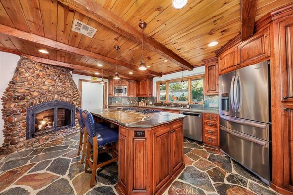 Fireplace, Interior, Kitchen, Pendant Lights, Recessed Lighting, Stainless Steel Appliances, Stone Walls, Wooden Beams, Wooden Ceilings