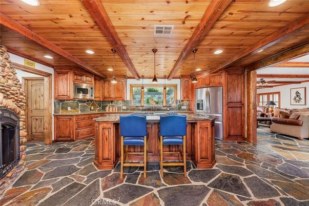 Fireplace, Interior, Kitchen, Pendant Lights, Recessed Lighting, Stainless Steel Appliances, Stone Walls, Wooden Beams, Wooden Ceilings