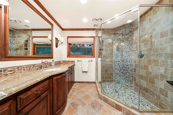 Bathroom, Dual Sink Vanities, Glass Shower, Interior, Recessed Lighting, Stone Walls