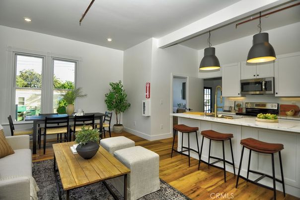 Dining room, Interior, Kitchen, Pendant Lights, Recessed Lighting, Stainless Steel Appliances, Wood Texture Flooring
