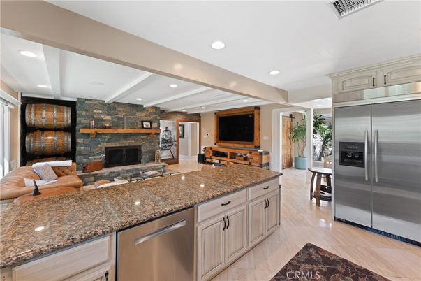 Fireplace, Interior, Kitchen, Living room, Recessed Lighting, Stainless Steel Appliances, Stone Walls