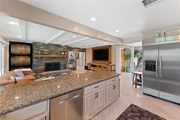 Fireplace, Interior, Kitchen, Living room, Recessed Lighting, Stainless Steel Appliances, Stone Walls