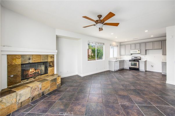 Empty room, Fireplace, Interior, Kitchen, Recessed Lighting, Stainless Steel Appliances