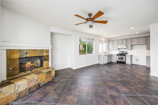 Empty room, Fireplace, Interior, Kitchen, Recessed Lighting, Stainless Steel Appliances
