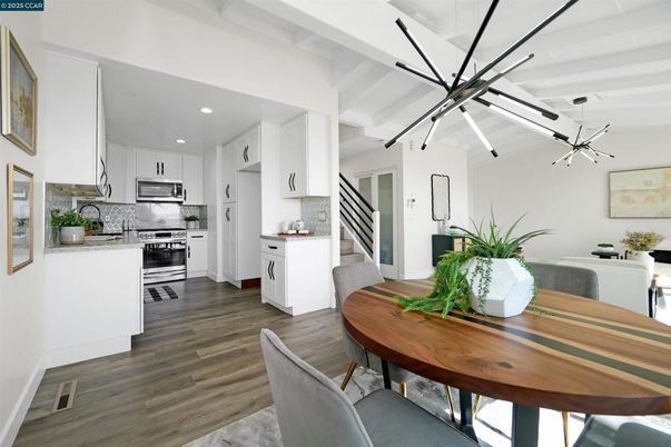 Dining room, Interior, Kitchen, Pendant Lights, Recessed Lighting, Stainless Steel Appliances, Wood Texture Flooring