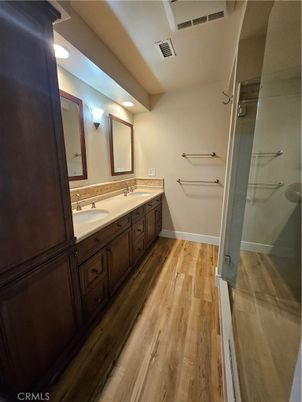 Bathroom, Dual Sink Vanities, Interior, Recessed Lighting, Wood Texture Flooring