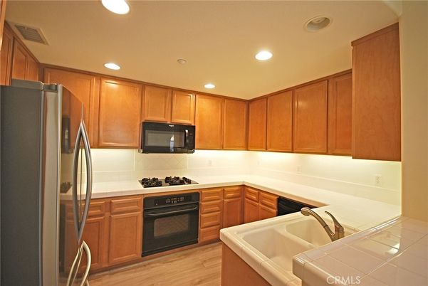 Interior, Kitchen, Recessed Lighting, Tile Countertops, Wood Texture Flooring