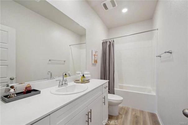 Bathroom, Dual Sink Vanities, Interior, Recessed Lighting, Wood Texture Flooring