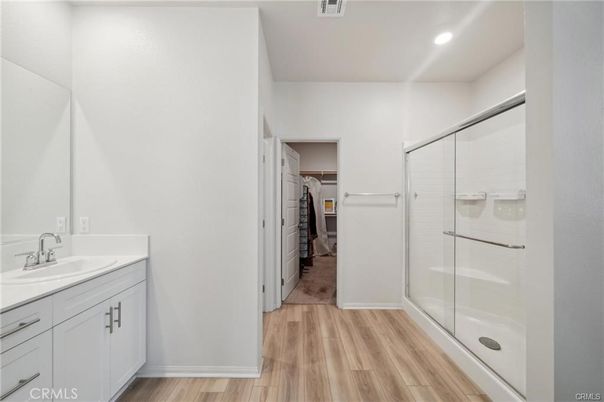Bathroom, Glass Shower, Interior, Recessed Lighting, Walk-in Closets, Wood Texture Flooring