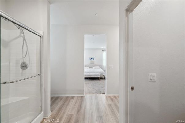 Bathroom, Bedroom, Glass Shower, Interior, Recessed Lighting, Wood Texture Flooring