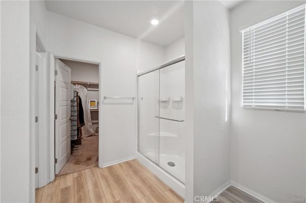 Bathroom, Glass Shower, Interior, Recessed Lighting, Walk-in Closets, Wood Texture Flooring