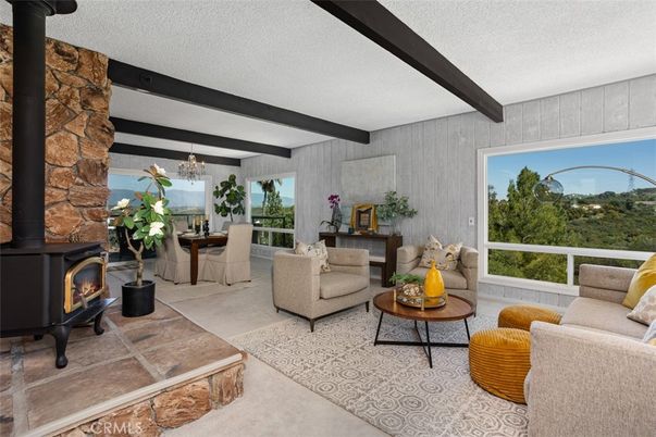 Chandelier, Dining room, Fireplace, Interior, Living room, Stone Walls, Wooden Beams