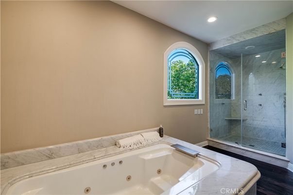 Bathroom, Glass Shower, Interior, Marble Walls, Recessed Lighting, Wood Texture Flooring