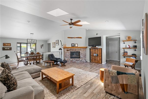 Dining room, Fireplace, Interior, Living room, Pendant Lights, Recessed Lighting, Wood Texture Flooring