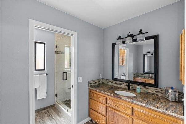 Bathroom, Dual Sink Vanities, Glass Shower, Interior, Wood Texture Flooring