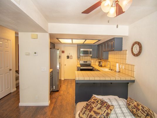 Interior, Kitchen, Stainless Steel Appliances, Tile Countertops, Wood Texture Flooring