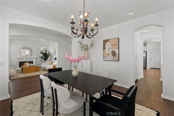 Chandelier, Dining room, Fireplace, Interior, Living room, Recessed Lighting, Wood Texture Flooring