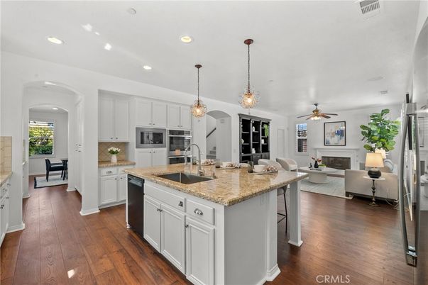 Dining room, Fireplace, Interior, Kitchen, Living room, Pendant Lights, Recessed Lighting, Stainless Steel Appliances, Wood Texture Flooring