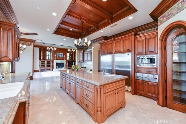 Chandelier, Fireplace, Interior, Kitchen, Pendant Lights, Recessed Lighting, Stainless Steel Appliances, Wooden Ceilings