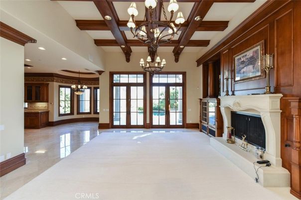 Chandelier, Empty room, Fireplace, Interior, Recessed Lighting, Wooden Beams