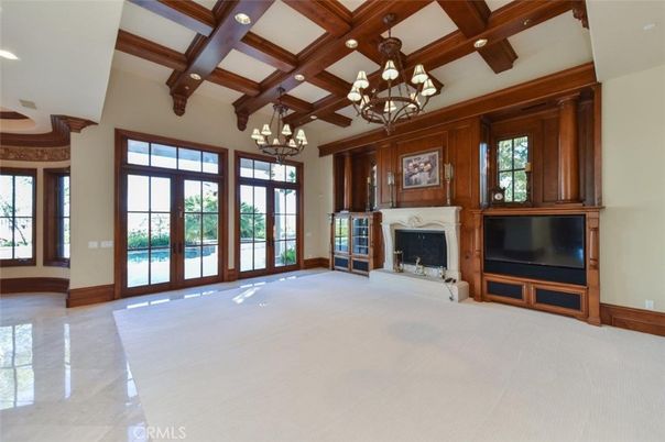 Chandelier, Empty room, Fireplace, Interior, Recessed Lighting, Wooden Beams