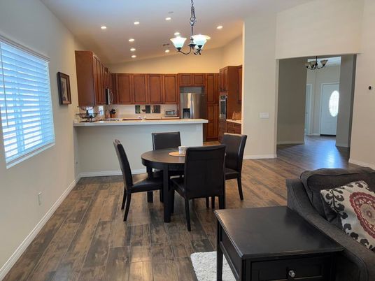 Chandelier, Dining room, Interior, Kitchen, Pendant Lights, Recessed Lighting, Stainless Steel Appliances, Wood Texture Flooring