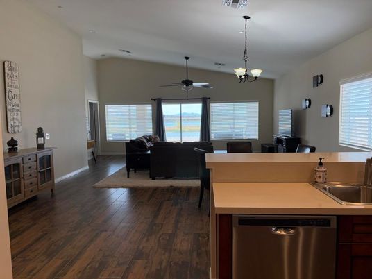 Chandelier, Dining room, Interior, Kitchen, Living room, Pendant Lights, Stainless Steel Appliances, Wood Texture Flooring