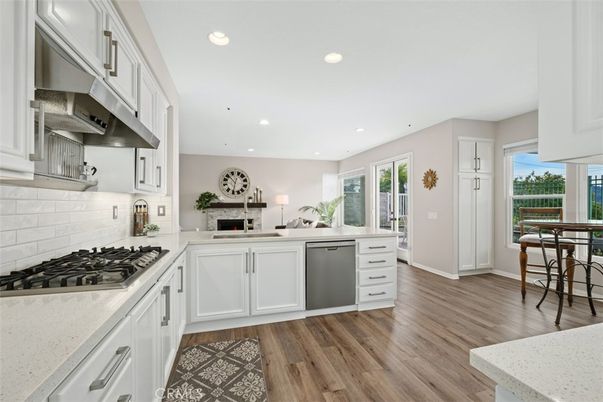Fireplace, Interior, Kitchen, Recessed Lighting, Stainless Steel Appliances, Wood Texture Flooring