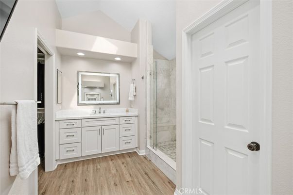 Bathroom, Glass Shower, Interior, Marble Walls, Recessed Lighting, Wood Texture Flooring