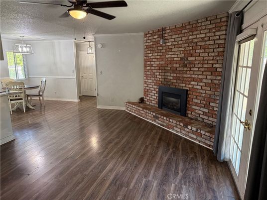 Dining room, Fireplace, Interior, Pendant Lights, Stone Walls, Wood Texture Flooring