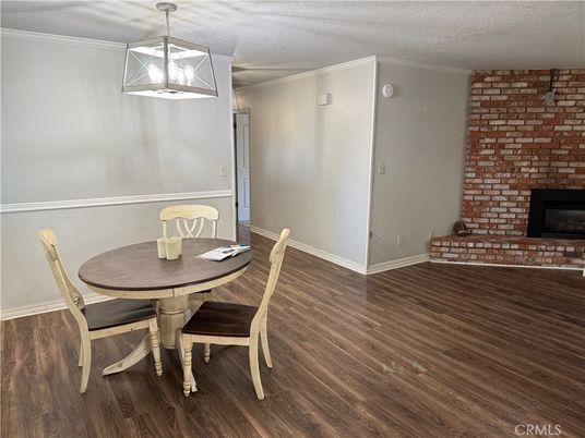 Dining room, Fireplace, Interior, Pendant Lights, Stone Walls, Wood Texture Flooring