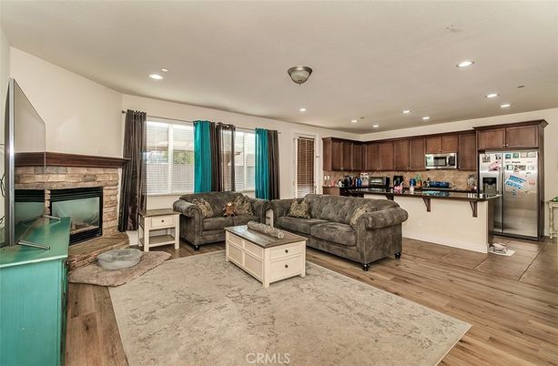 Fireplace, Interior, Kitchen, Living room, Recessed Lighting, Stainless Steel Appliances, Wood Texture Flooring